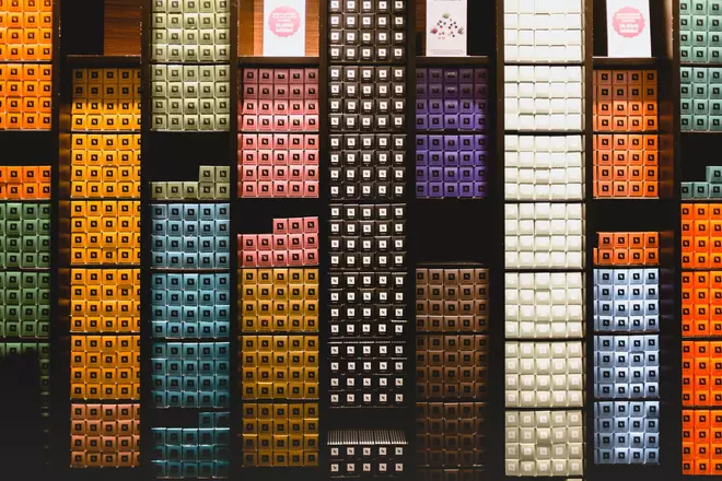 Shelves filled with Nespresso coffee pods